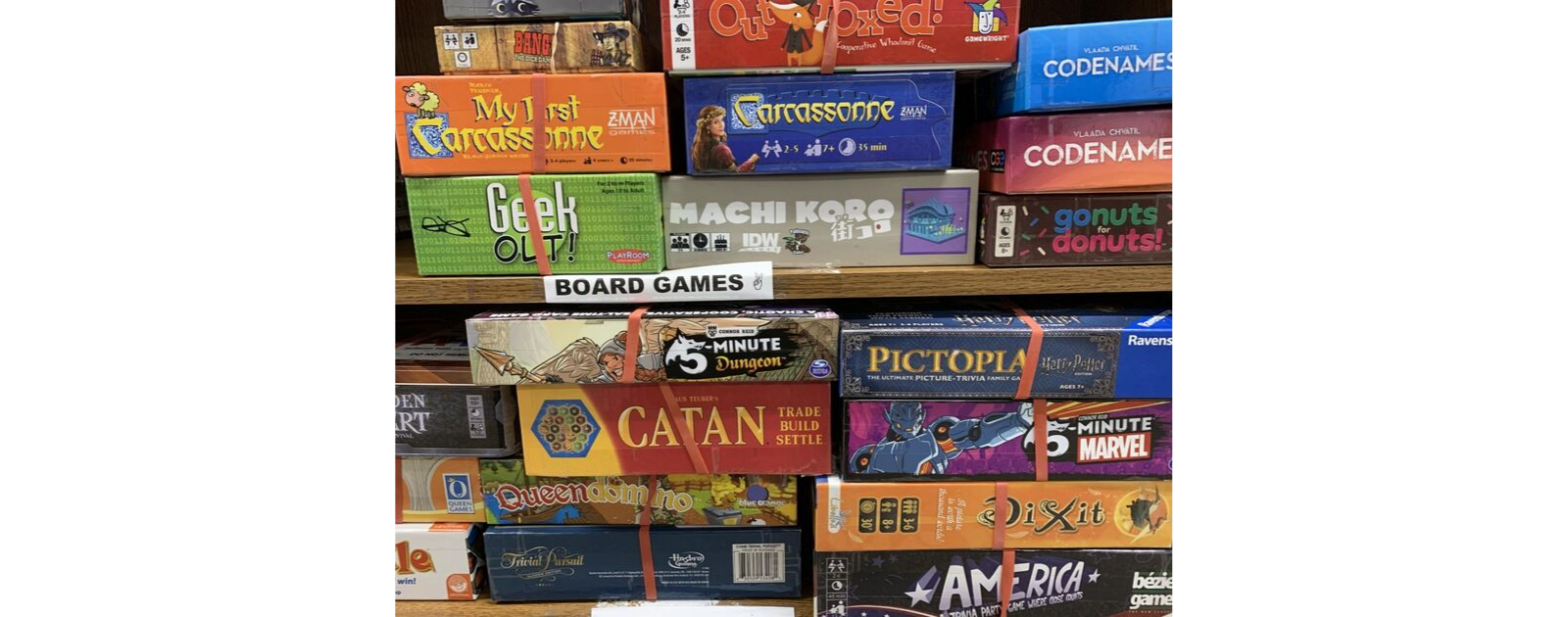 a shelf of board games