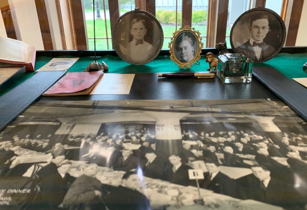 a display case filled with old photographs and memorabilia